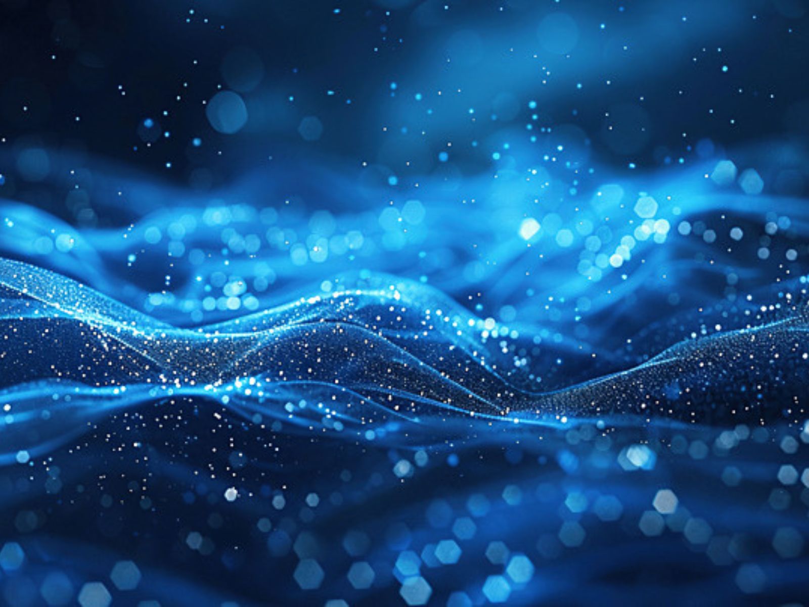 Person holding pen over papers on a table.